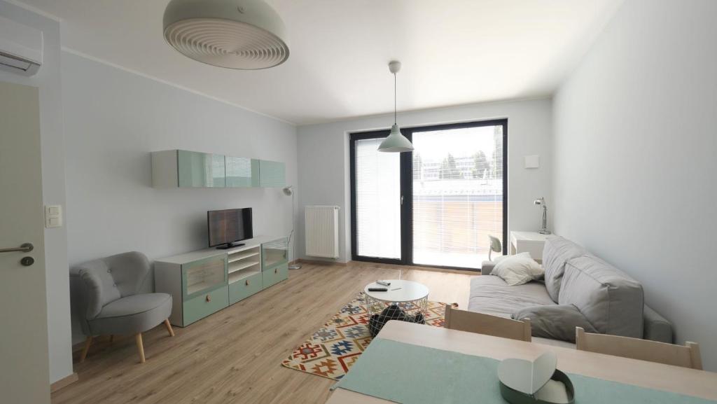 Posezení v ubytování Air-conditioned, 2 room apartment with terrace