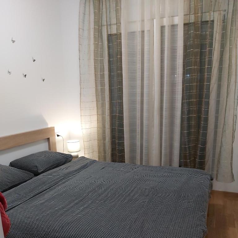Postel nebo postele na pokoji v ubytování Apartman Miss T