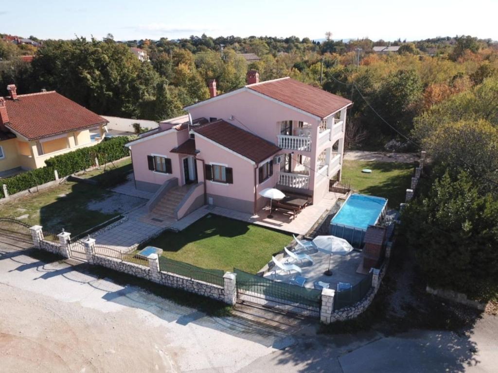an aerial view of a house with a swimming pool at House Diminić in Labin