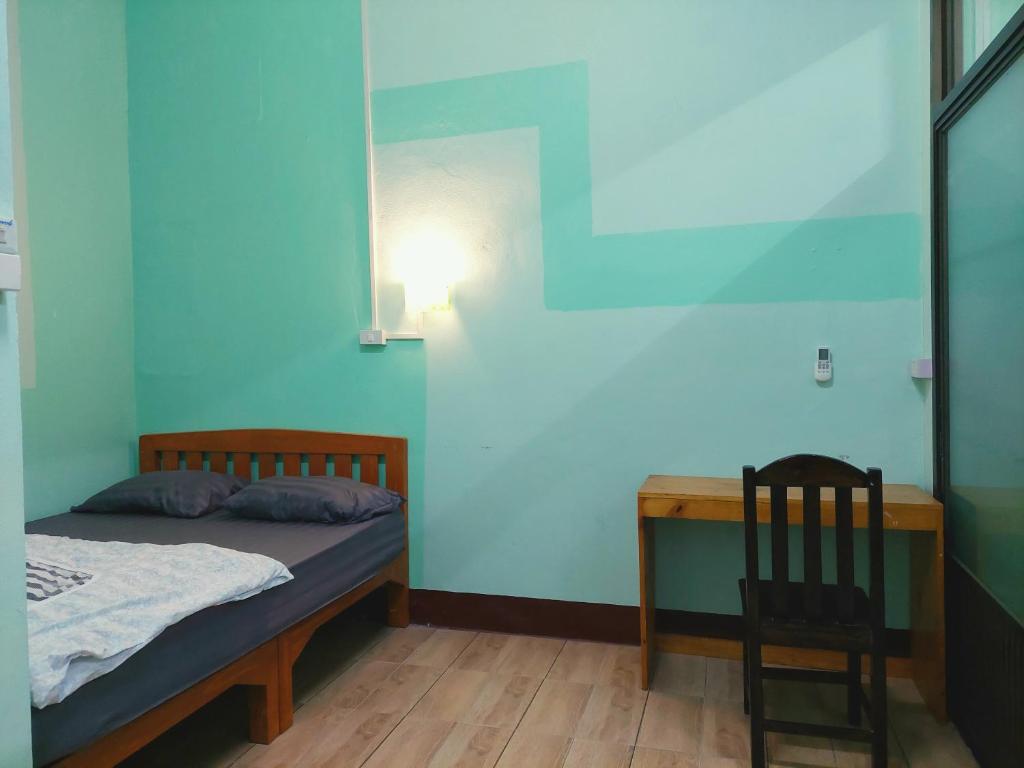 Een bed of bedden in een kamer bij JaiSabai Homestay