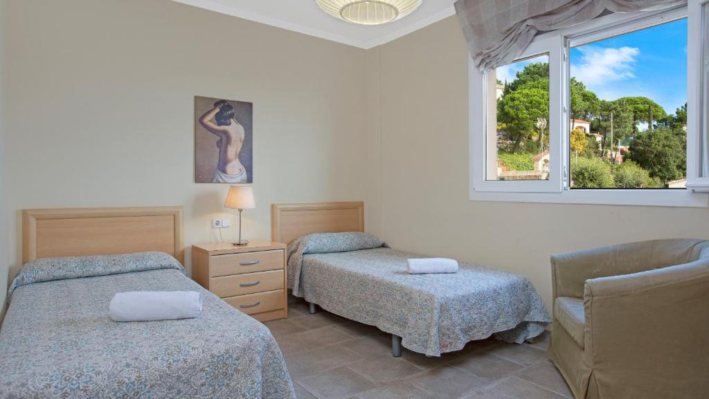 Posteľ alebo postele v izbe v ubytovaní 2 Garb - Lloret de Mar