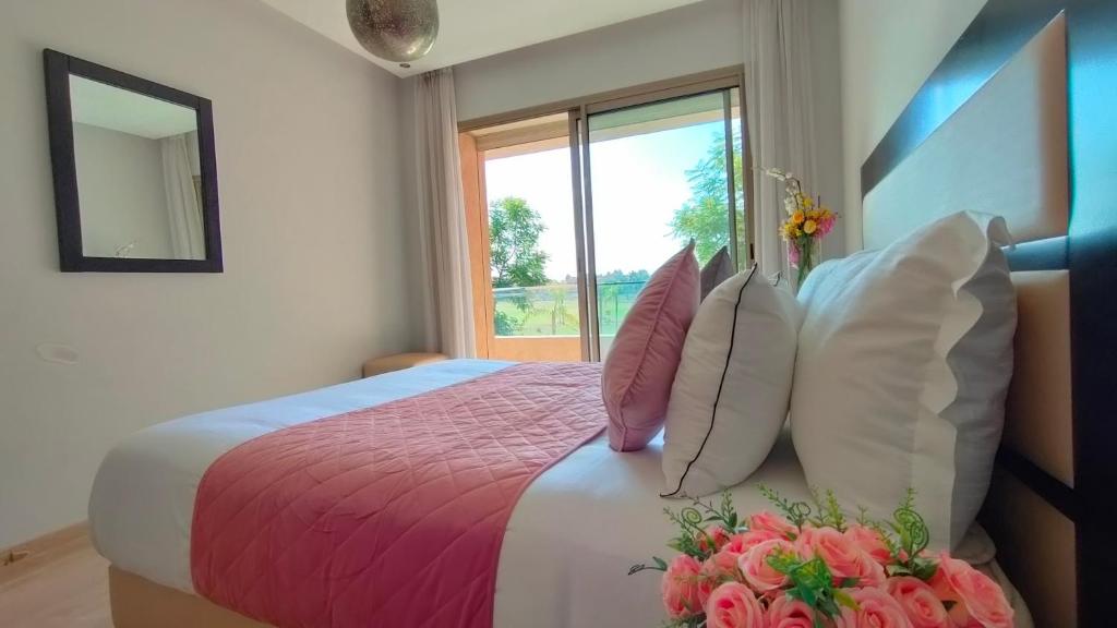 En eller flere senge i et værelse på Prestigia Appartement de luxe