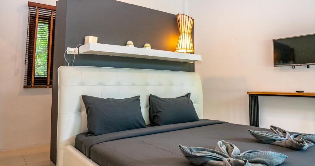Postel nebo postele na pokoji v ubytování Aqua Suites