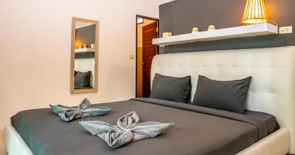 Postel nebo postele na pokoji v ubytování Aqua Suites
