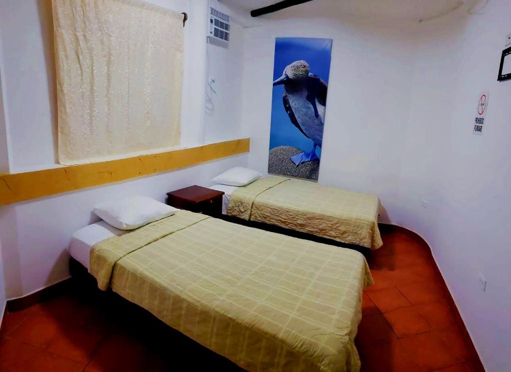 Postel nebo postele na pokoji v ubytování Hotel Crossman