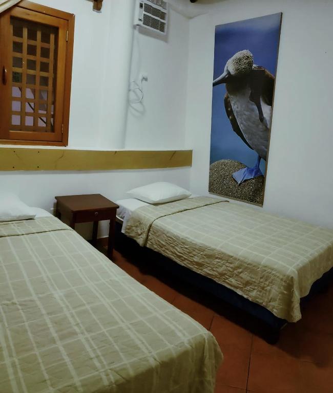Postel nebo postele na pokoji v ubytování Hotel Crossman