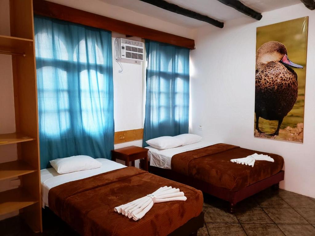 Postel nebo postele na pokoji v ubytování Hotel Crossman