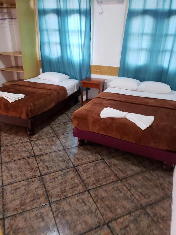 Postel nebo postele na pokoji v ubytování Hotel Crossman