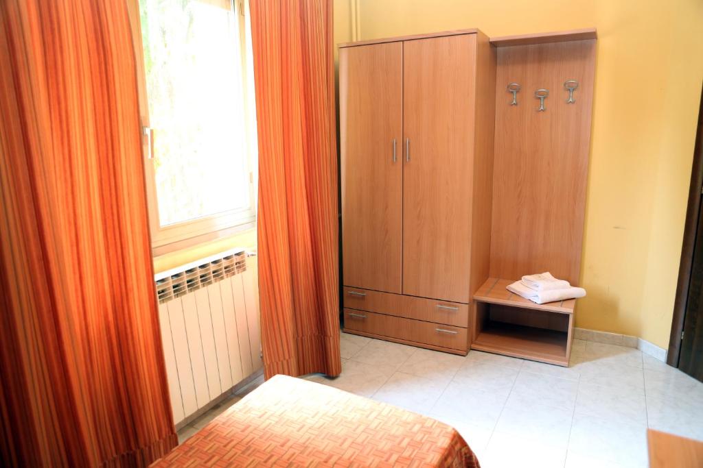 Łóżko lub łóżka w pokoju w obiekcie Hotel Bicocca