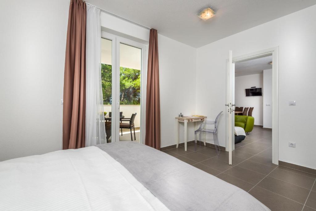 Posteľ alebo postele v izbe v ubytovaní Apartments Domani