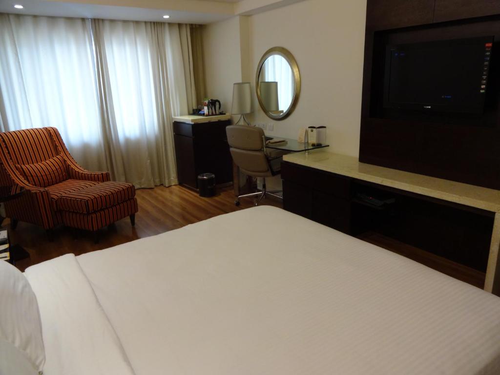 Postel nebo postele na pokoji v ubytování Savera Hotel