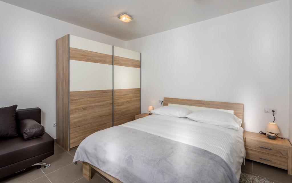 Posteľ alebo postele v izbe v ubytovaní Apartments Domani
