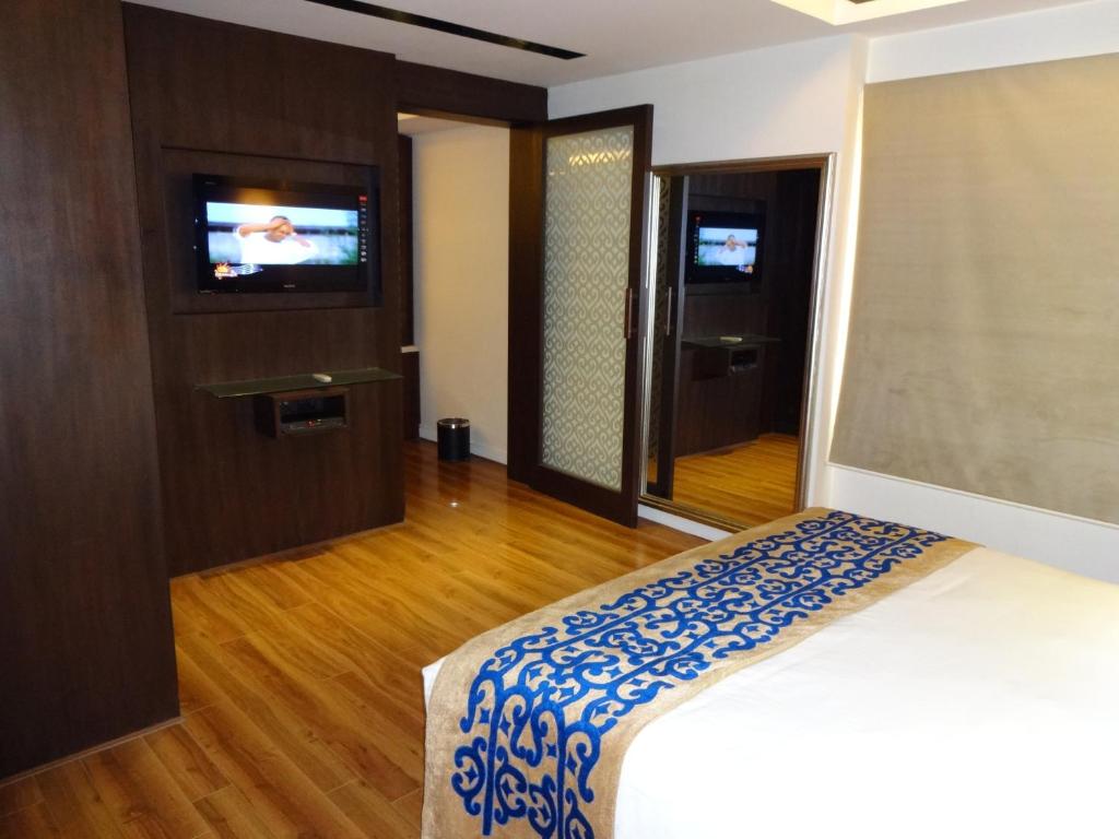 Postel nebo postele na pokoji v ubytování Savera Hotel