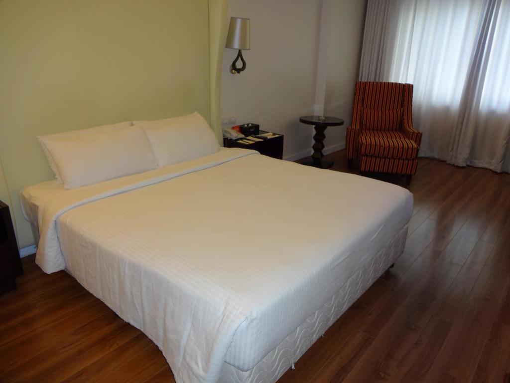 Postel nebo postele na pokoji v ubytování Savera Hotel