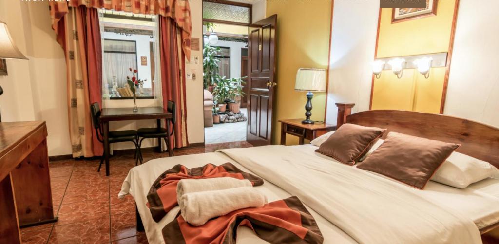 Postel nebo postele na pokoji v ubytování Hotel Amón Real Costa Rica