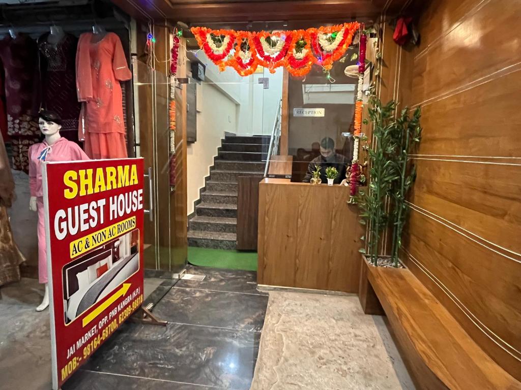 a store with a sign that reads sharma guest house at Sharma Guest House, Himachal Pradesh in Kangra