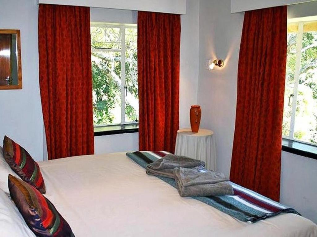 מיטה או מיטות בחדר ב-Ondini Guest House