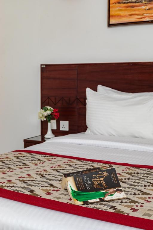 Postel nebo postele na pokoji v ubytování PrideInn Hotel Nyali