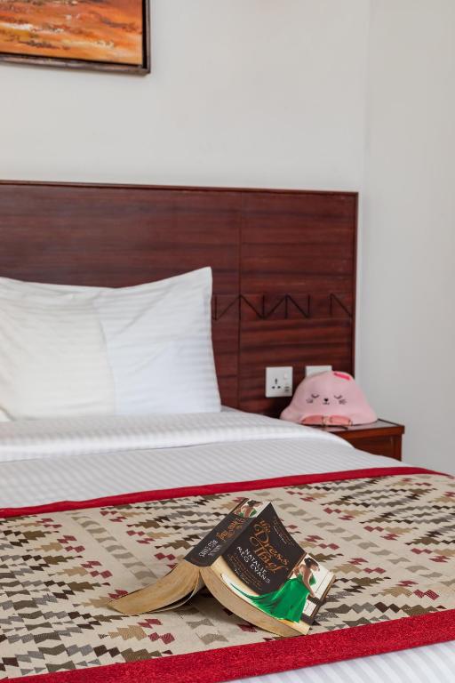 Postel nebo postele na pokoji v ubytování PrideInn Hotel Nyali