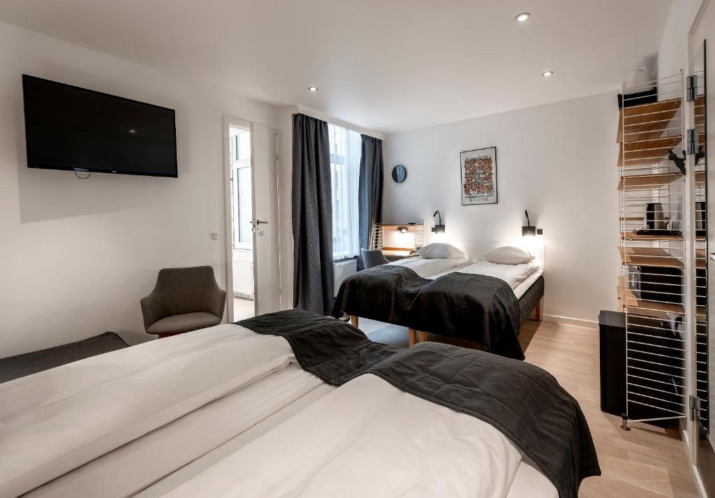Postel nebo postele na pokoji v ubytování Go Hotel Ansgar