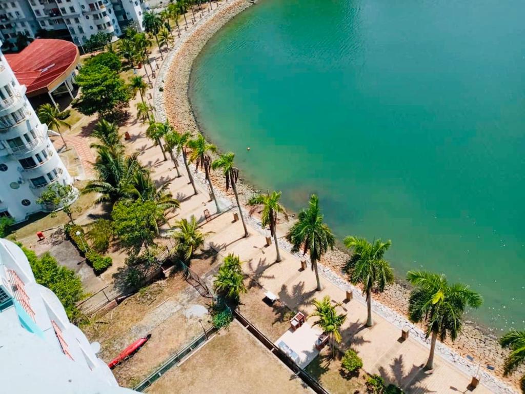 an aerial view of a beach with palm trees at PD Lagoon Resort in Port Dickson