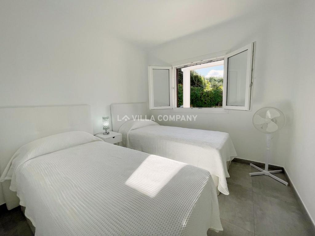 Posteľ alebo postele v izbe v ubytovaní Villa de Amigos