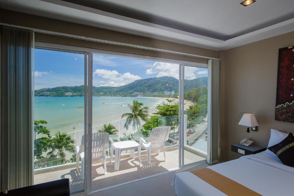 a hotel room with a view of the ocean at The Front Hotel and Apartments in Patong Beach