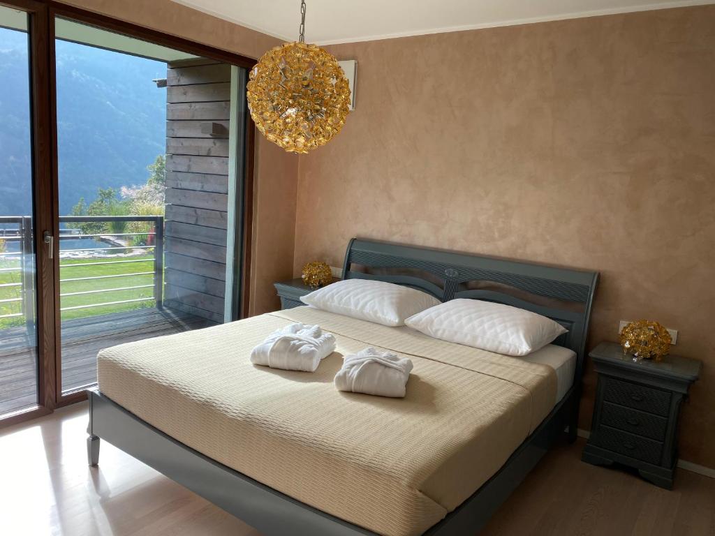 Posteľ alebo postele v izbe v ubytovaní VILLA COLLINA VERDE