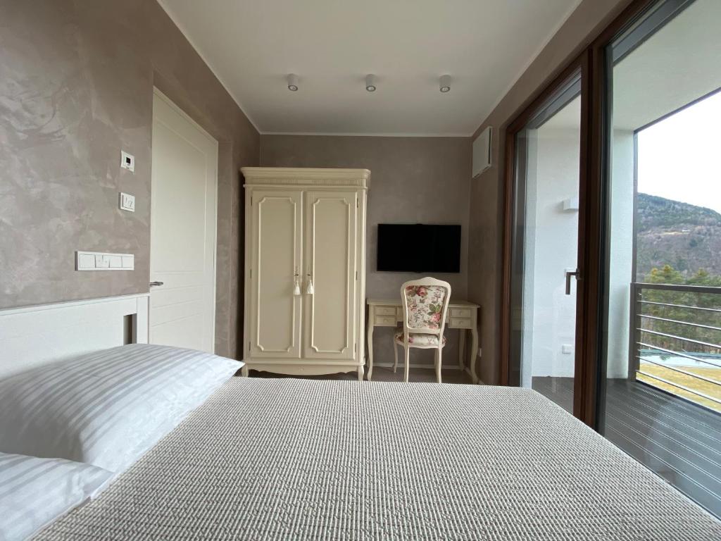 Posteľ alebo postele v izbe v ubytovaní VILLA COLLINA VERDE