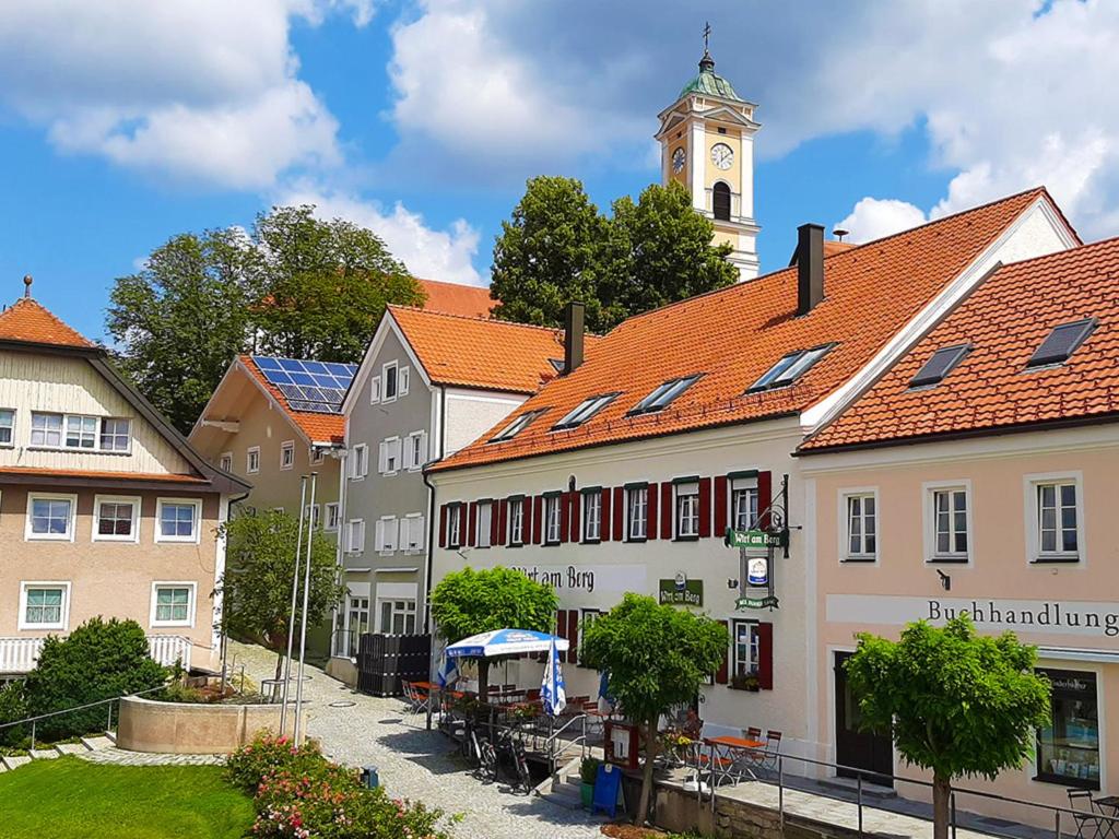 a group of buildings with a clock tower at Ferienwohnung Liparis in Bad Birnbach