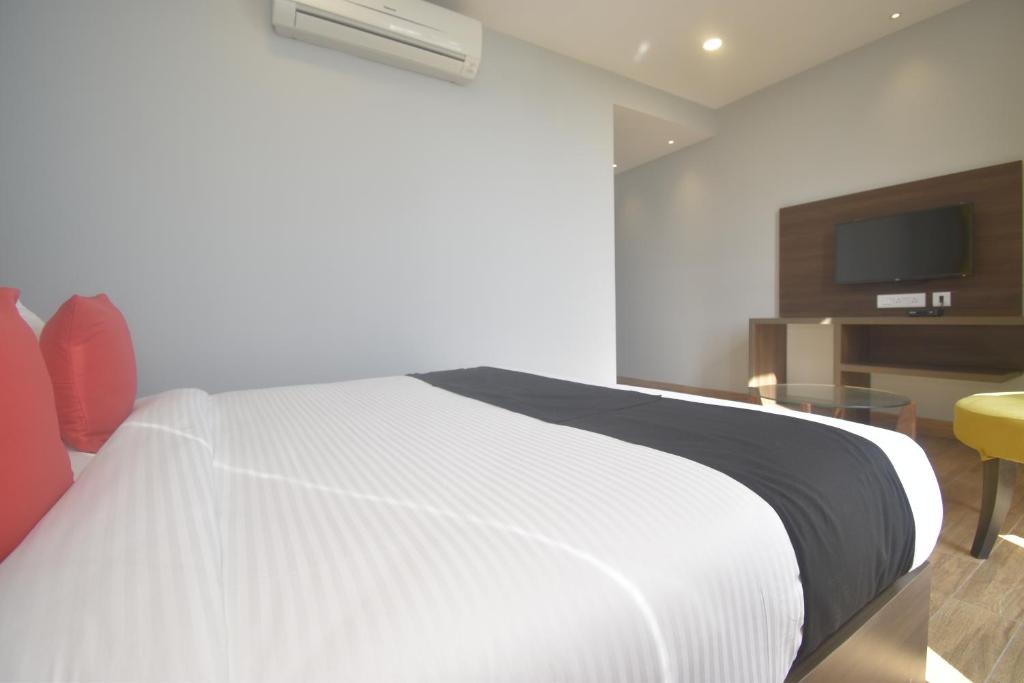Postel nebo postele na pokoji v ubytování Ka10 SQUARE HOTEL & BANQUETS