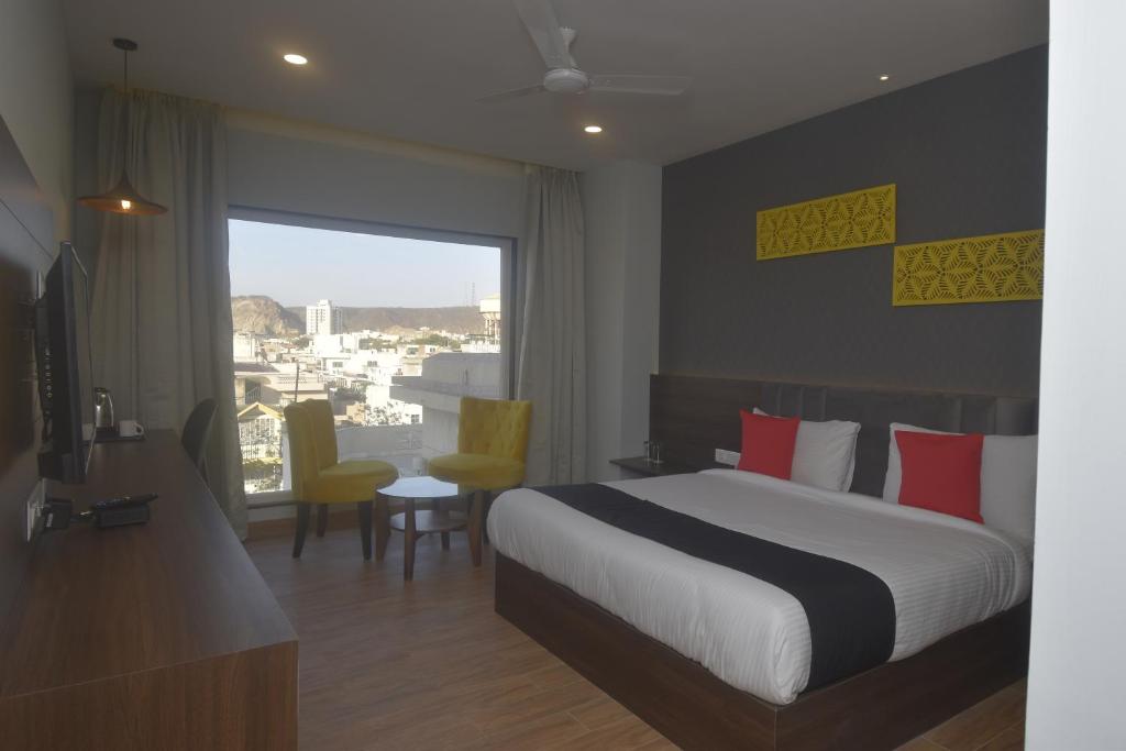 Postel nebo postele na pokoji v ubytování Ka10 SQUARE HOTEL & BANQUETS