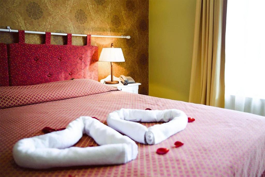 Postel nebo postele na pokoji v ubytování Hotel Metsis