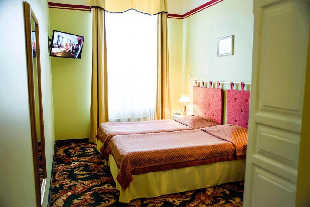 Postel nebo postele na pokoji v ubytování Hotel Metsis