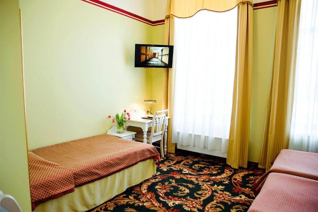 Postel nebo postele na pokoji v ubytování Hotel Metsis