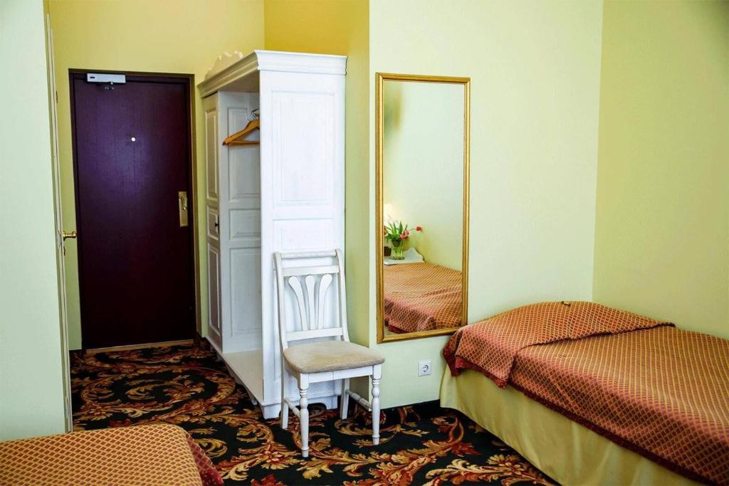 Postel nebo postele na pokoji v ubytování Hotel Metsis