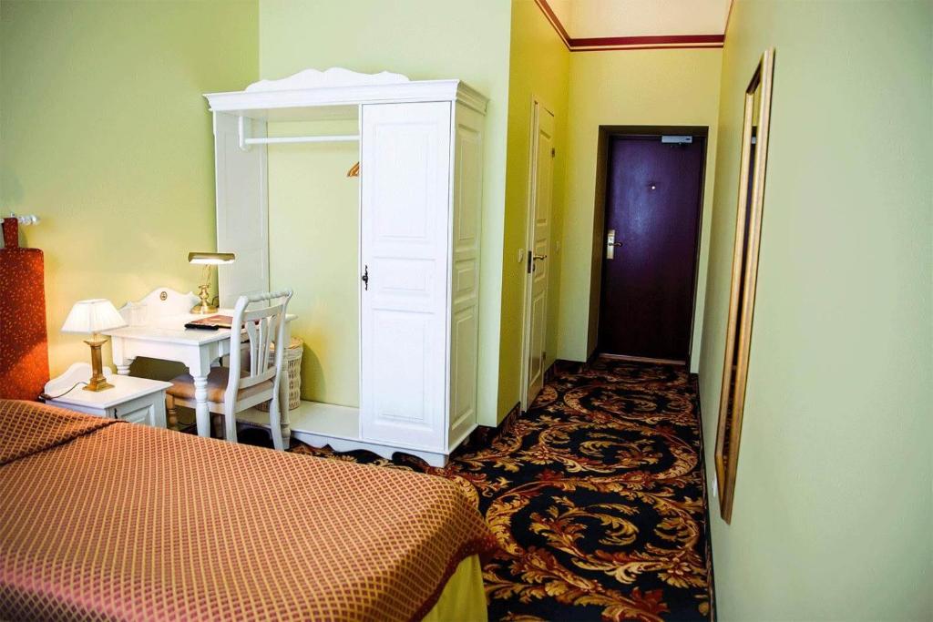 Postel nebo postele na pokoji v ubytování Hotel Metsis