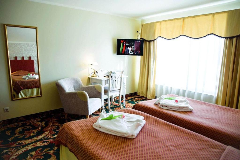 Postel nebo postele na pokoji v ubytování Hotel Metsis