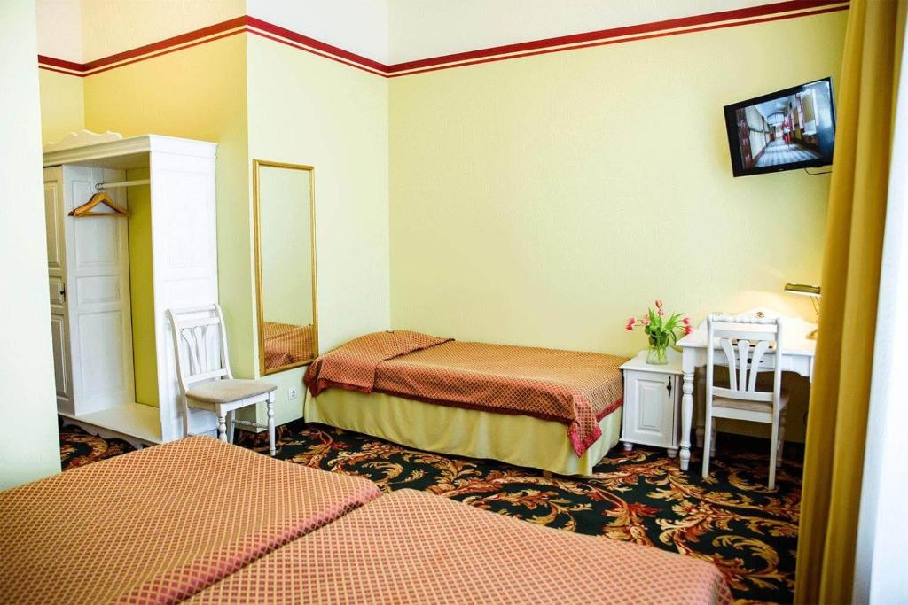 Postel nebo postele na pokoji v ubytování Hotel Metsis