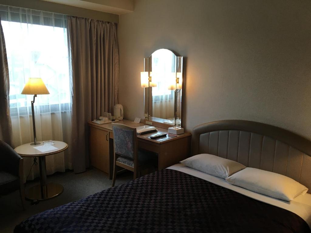 Postel nebo postele na pokoji v ubytování Urayasu Beaufort Hotel