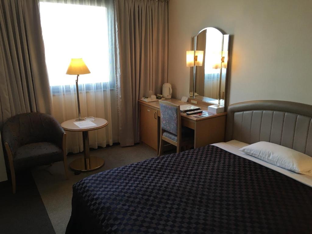 Postel nebo postele na pokoji v ubytování Urayasu Beaufort Hotel