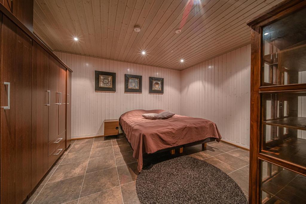 Кровать или кровати в номере Levillas Kinnastie 35 Villas