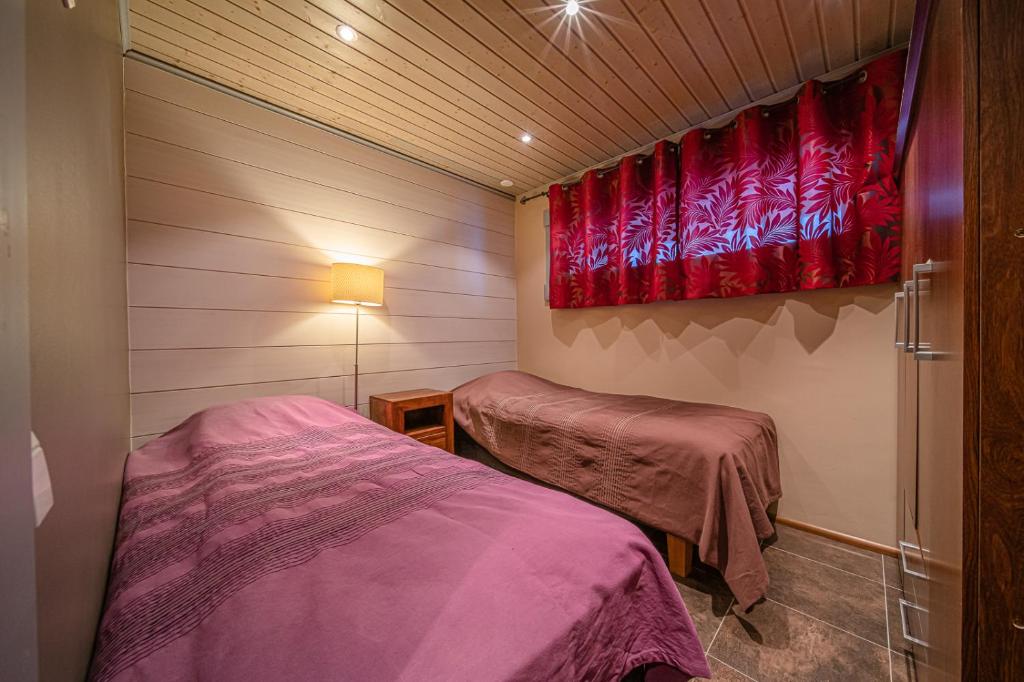 Кровать или кровати в номере Levillas Kinnastie 35 Villas