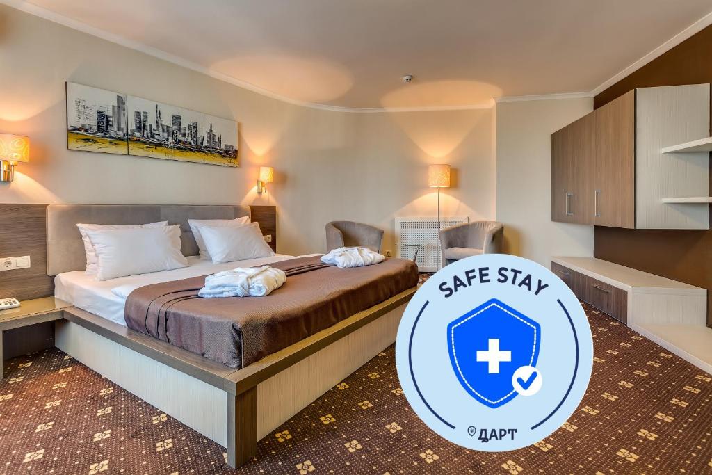 a hotel room with a bed with a star stay sign on it at Bratislava Hotel Kyiv in Kyiv