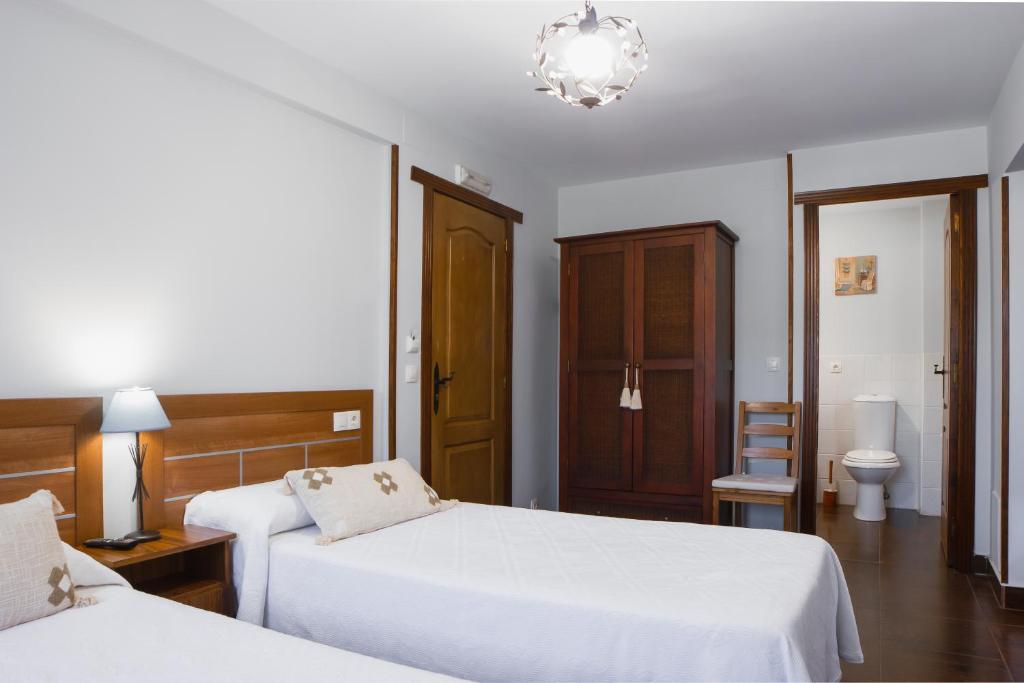Postel nebo postele na pokoji v ubytování La Posada de Ojébar Rústica