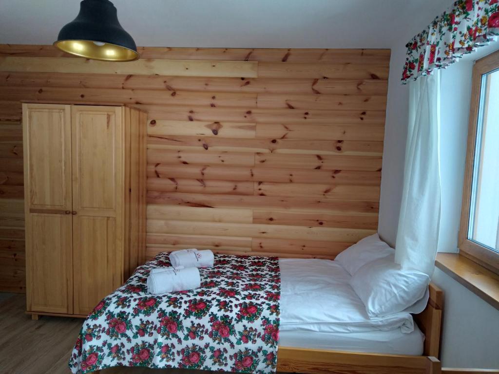 Postel nebo postele na pokoji v ubytování Ostoja Gromadzyń
