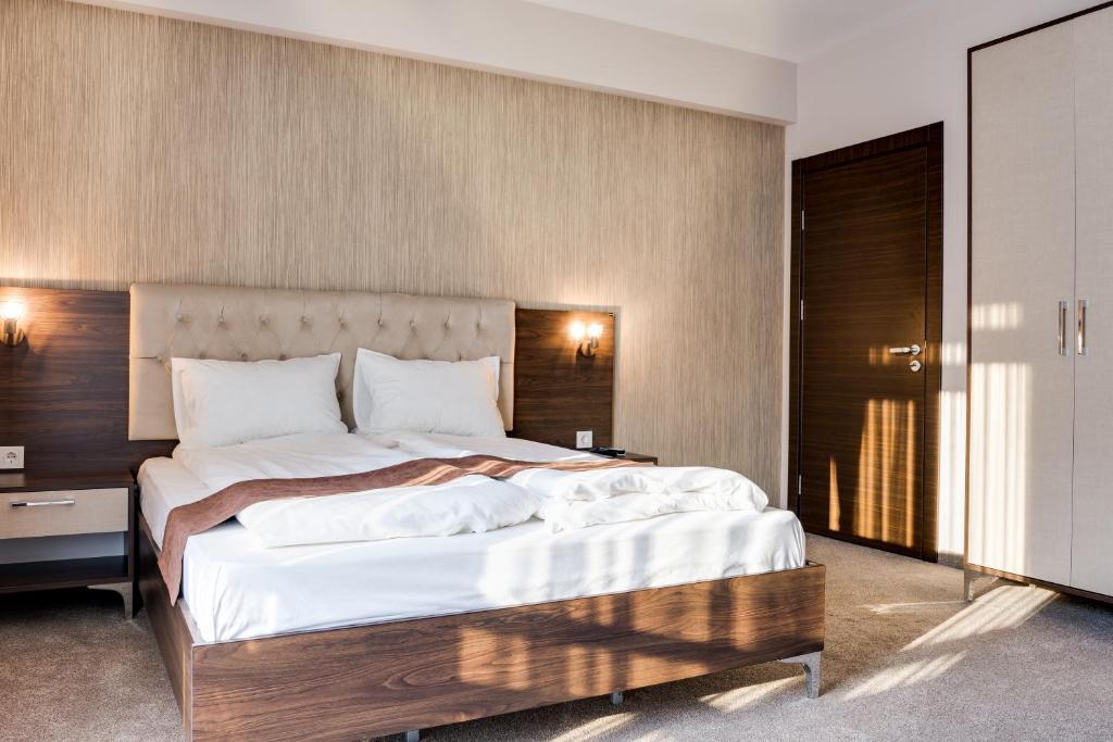 Postel nebo postele na pokoji v ubytování Family Hotel LILIUM