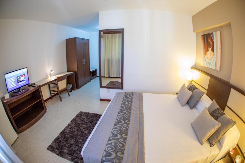 TV a/nebo společenská místnost v ubytování Mondrian Suite Hotel