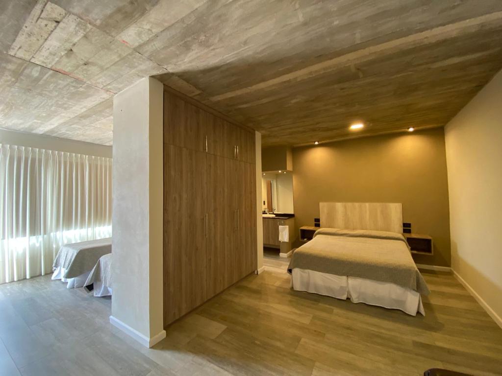Cama o camas de una habitación en De Paso Apart