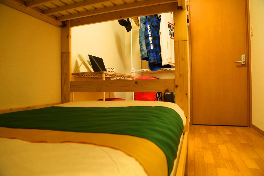 Postel nebo postele na pokoji v ubytování E JOY INN-West Shinjuku Branch